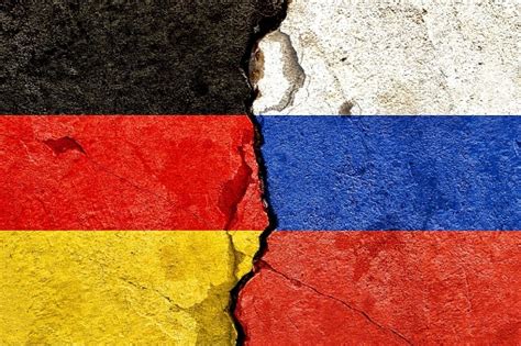 Germany Vs Russia National Flags Icon Painted On Dirty Cracked Concrete