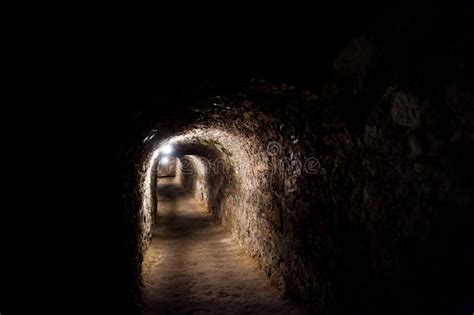 Dark Scarry Tunnel With A Few Lights Under The Castle Stock Image