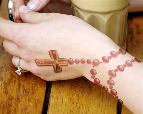 One thing to remember, the rosary is a religious symbol, so you have to make sure that it feels right wearing this kind of tattoo. 15 Intriguing Rosary Tattoo Designs and their Sacred Meanings