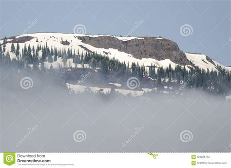 Snowy Mountain Peaks Standing Above The Clouds Stock Photo Image Of