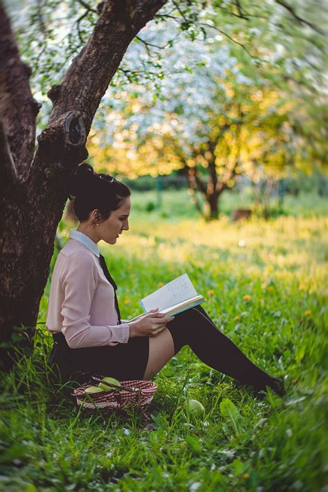 Woman Sitting Green Lawn Tree Reading Book Daytime People Girl