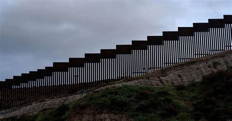 Border patrol vehicle looks out across the border wall at tecate, mexico, a city famous. Federal Judge Dismisses House of Representatives Border ...