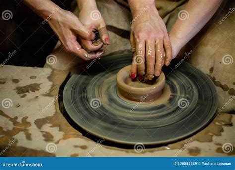 Pottery Classes Student Making Clay Pot On Wheel Close Up Of Dirty