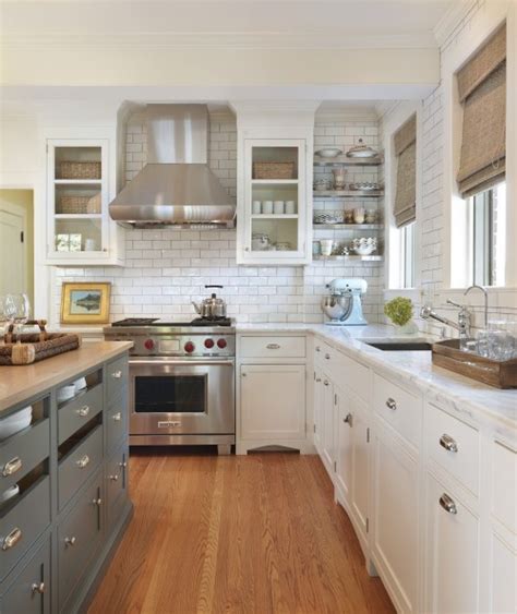 Kitchen island with built in seating might look like a weird idea for your kitchen, but if you have enough space you need to consider this option. White Kitchen with Gray Island | Content in a Cottage