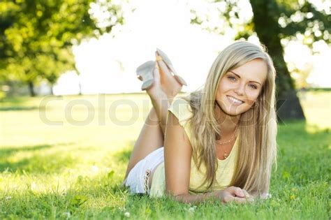 Portrait Of Young Smiling Woman In The Summer Park Stock