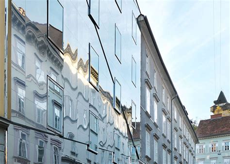 This Stainless Steel Building Reflects The Historic Architecture Around