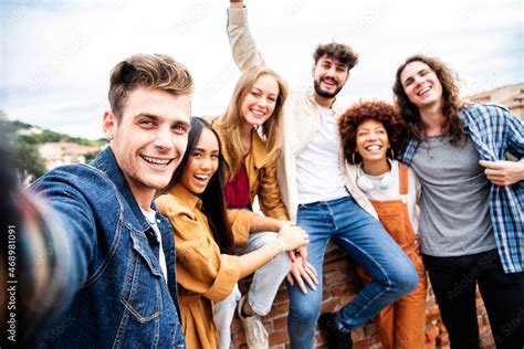 Multicultural Best Friends Having Fun Taking Group Selfie Portrait Outside Smiling Guys And