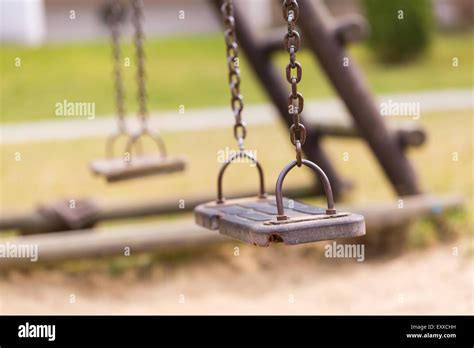 Empty Swing On Children Playground In City Stock Photo Alamy