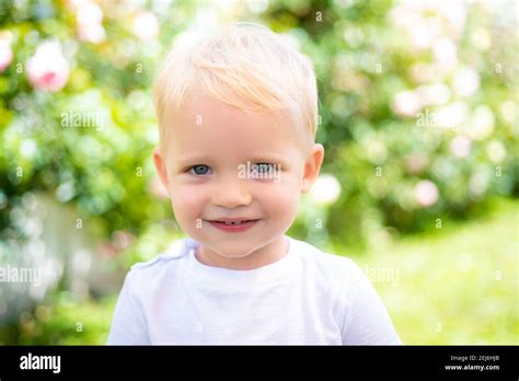 Cute Smile Kids Face Closeup Portrait Of Smiling Child Boy On Blur