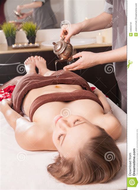 Woman Enjoying Ayurveda Oil Massage In Spa Stock Image Image Of