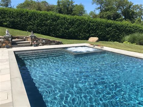 Reflecting pool, a shallow pool designed to reflect a structure and its surroundings. Corner Spa Gunite Pool Blue Ice Patio in Shelter Island ...
