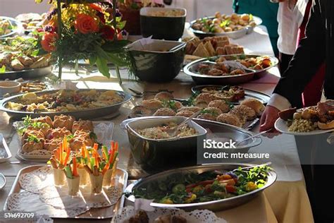 Image Of People Serving Themselves Buffet Table Of Party Food Stock