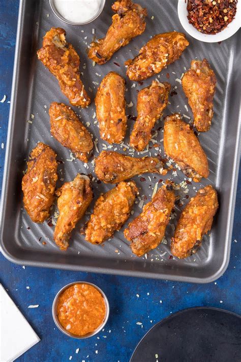When the chicken is cooked through, toss. Garlic Parmesan Chicken Wings - In a pan, ready to serve ...