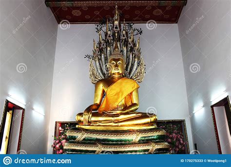 The Golden Buddha Statue Sheltered By Naga Hood In A Thai Temple Stock