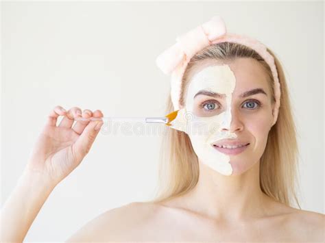 Beauty Treatments Portrait Of Spa Caucasian Girl Applying Facial Mask