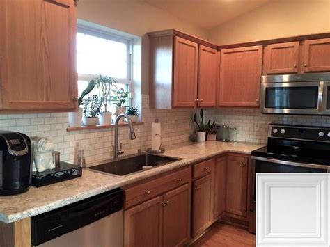 Even with these cabinets, your kitchen doesn't look outdated. White Kitchen Cabinets With Light Quartz Countertops # ...