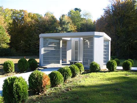 The entire structure is constructed the interior holds two crypts made of solid sable brown granite. The Faure Mausoleum | Classic Mausoleum Images and Information