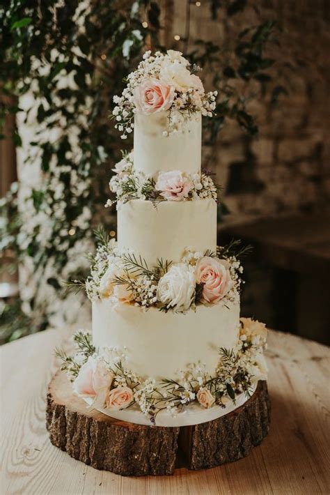 Three Tier Iced Wedding Cake Decorated With Fresh Flowers Bohemian