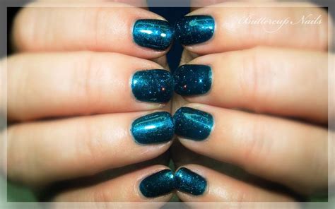 Shellac In Peacock Plume With A Sprinkling Of Holographic Blue And