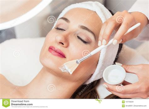 Close Up Of A Beautiful Woman Relaxing During Facial Treatment I Stock