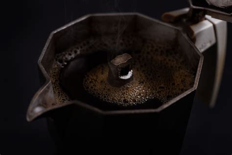 Premium Photo Isolated Moka Coffee Maker Closeup On Black Background