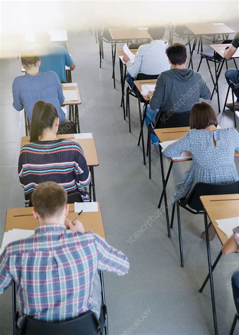College Students Taking Test At Desks Stock Image F0184939