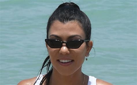 kourtney kardashian is beachy in a string bikini body chain and sandals footwear news