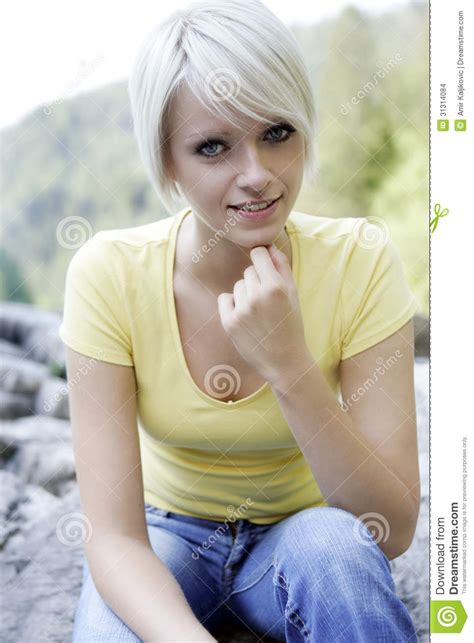 Portrait Of A Smiling Blond Woman Outdoors Stock Images