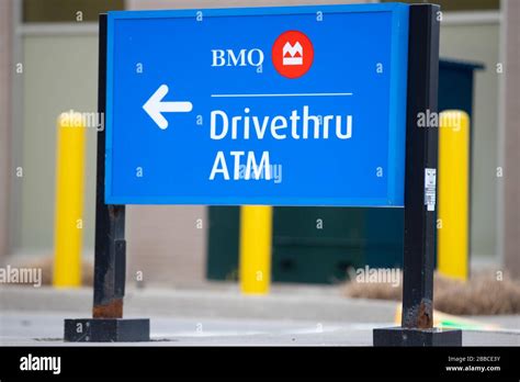 Close Up Of A Sign Showing Bmo Drive Thru Atm Bank Of Montreal Is A