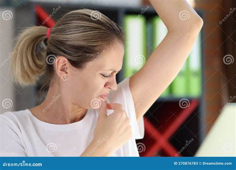 Young Female Sniffing Armpits And Feeling Of Revulsion Because Of Smell