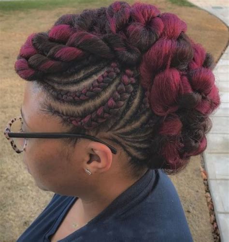 There are various variations of this hairstyle that have cropped up since it was introduced in the 70s. Red Highlights with Mohawk Braids