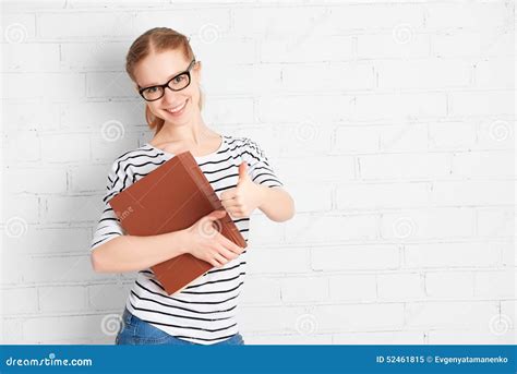 Happy Successful Student Girl With Book Showing Thumbs Up Stock Image