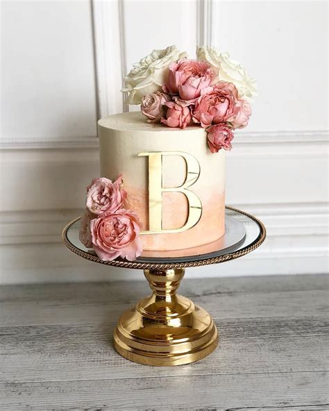 Posh babe Cakes on Instagram B is for Bella Peach ombré with deluxe blooms a Birthday