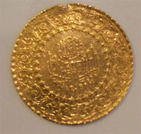 Need Help Identifying Gold Color Coinmedallion From 1991 Coin