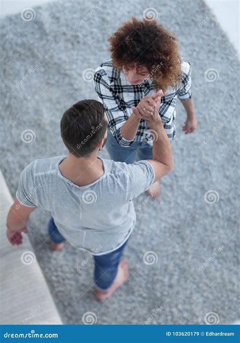 Young Couple Give Each Other Five In New Living Room Stock Image