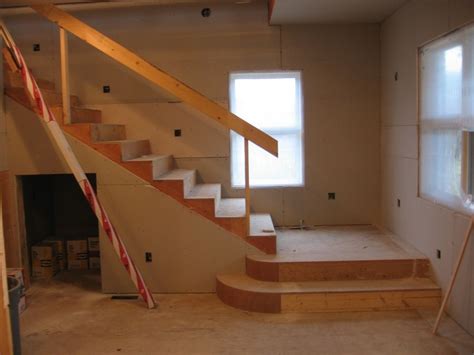 My basement has an outdoor entrance. basement stair landing ideas. middle stairs with this on ...