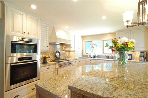 See more ideas about kitchen paint, kitchen cabinet colors, kitchen cabinets. Close-up of light colored granite counters with creamy ...