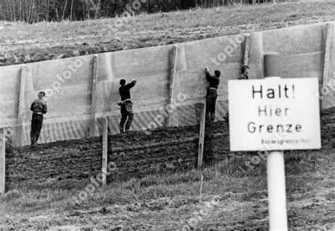 Members Of The Gdr Border Troops Renew The Fortifications On The Inner