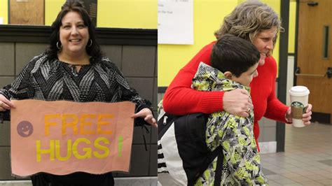 Teachers At Covington Elementary School Greet Students With Hugs For