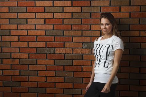 Young Woman Against Brick Wall Stock Photo Image Of Glamourous White
