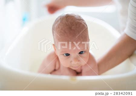 Unrecognizable Mother Bathing Her Son In White Pixta