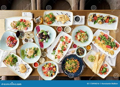 Many Different Delicious Dishes Dishes On The Table Various Snacks And