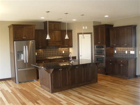 What color are your cabinets goes best with them? Walnut cabinets with hickory flooring | New Home ideas | Pinterest | Tile, Stainless steel and ...