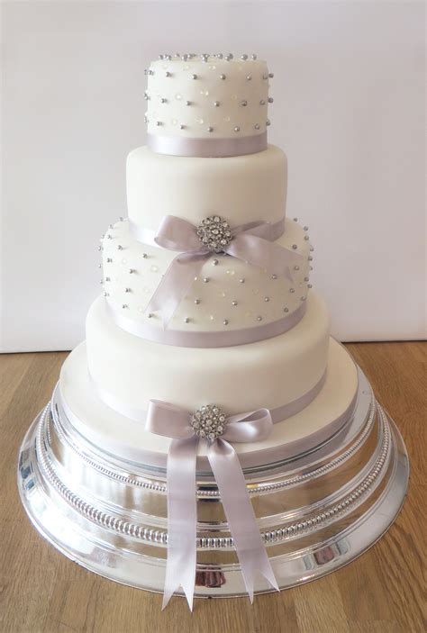 Wedding favor messages are indeed a great way to thank your guests thus make them feel that their show your deep appreciation by sending a thoughtful thank you messages on your wedding favors. Wedding Cake with Lilac Pearls and Ribbon - The Cakery ...
