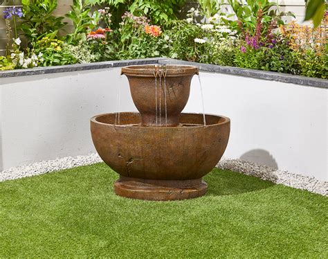A waterfall is a very appropriate feature to include in a wooded, rocky area of your backyard. Tuscan Pour Easy Fountain Garden Water Feature - £349 | Garden4Less UK Shop