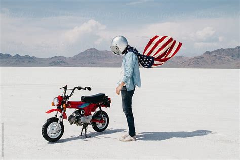 Portrait Of Young Male Wearing American Flag While Riding Motorcycle