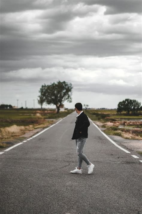 Person Standing On Road Photo Free Grey Image On Unsplash