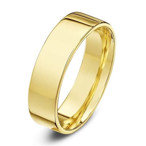 The item has been tested and in my opinion the metal is no better than 9ct yellow gold. 18ct Yellow Gold Heavy Weight Flat Court Shape Wedding Ring