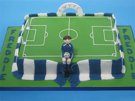 Football cakes designs can be of many shapes and sizes. Football pitch cake made from chocolate sponge, covered in fondant and wrapped in a fondant ...