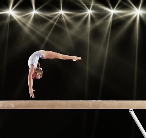 Young Female Gymnast On Balance Beam By Robert Decelis Ltd
